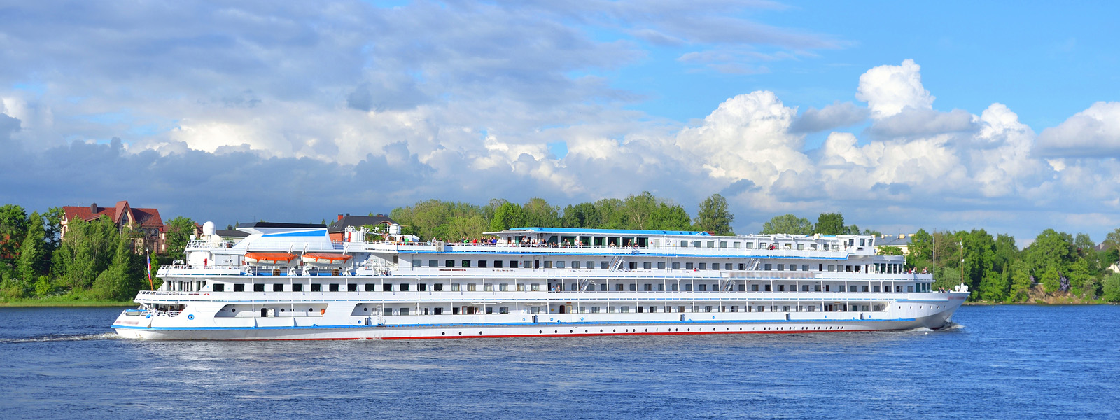 A river cruise ship moored beside a European town