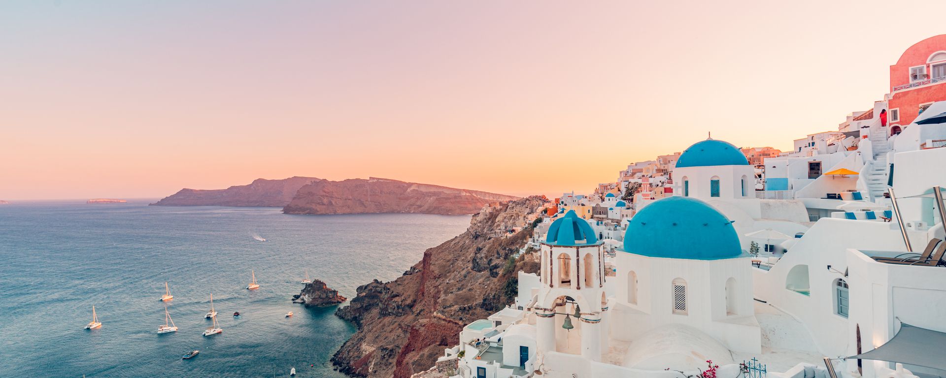 White and blue houses above the sea on Santorini