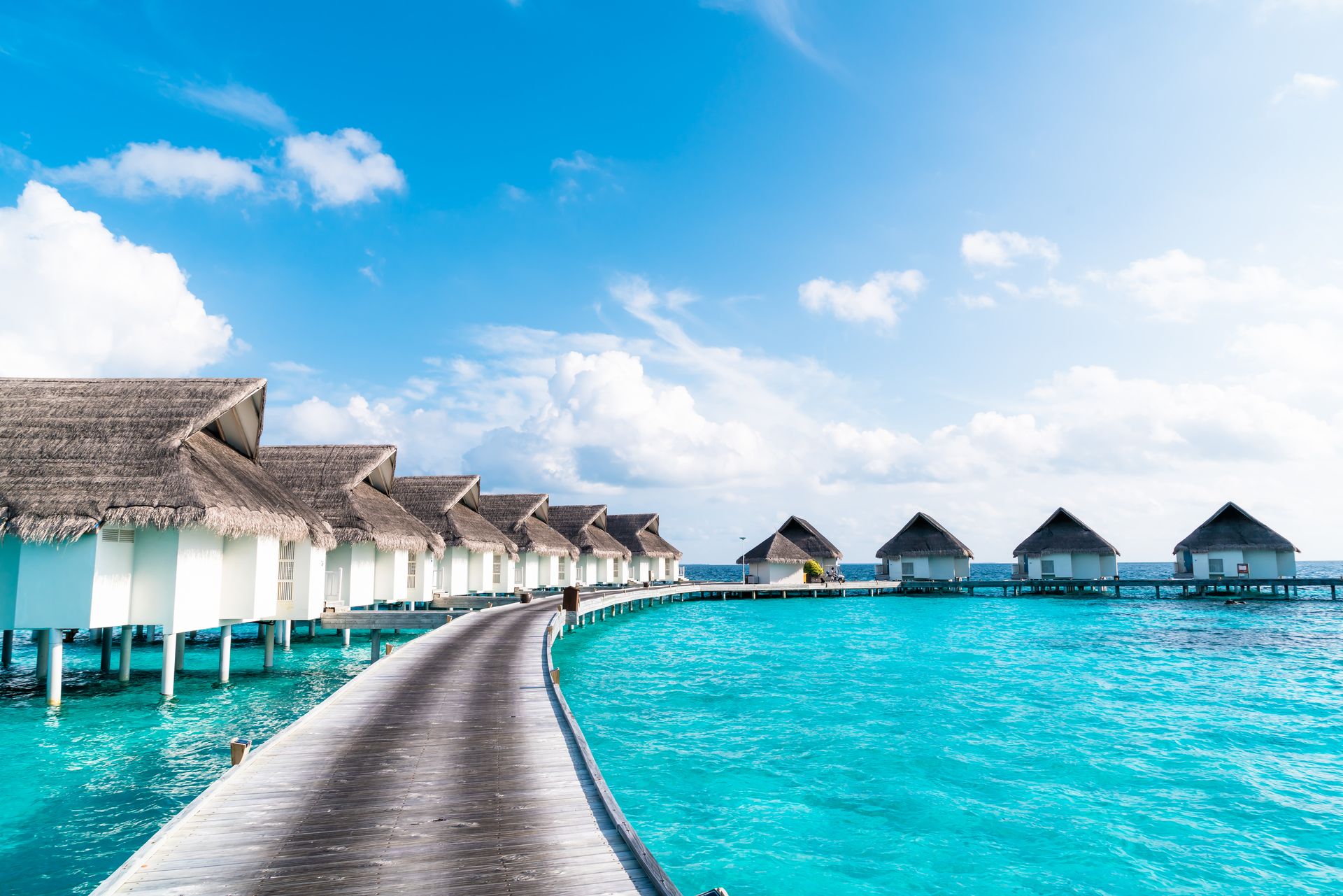 Overwater villas and a beach on a tropical island